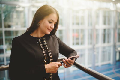 Businesswoman phoning in office