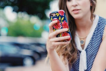 Close up of woman on her iphone.