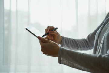 person signing the document on device, concept of e-signature, modern