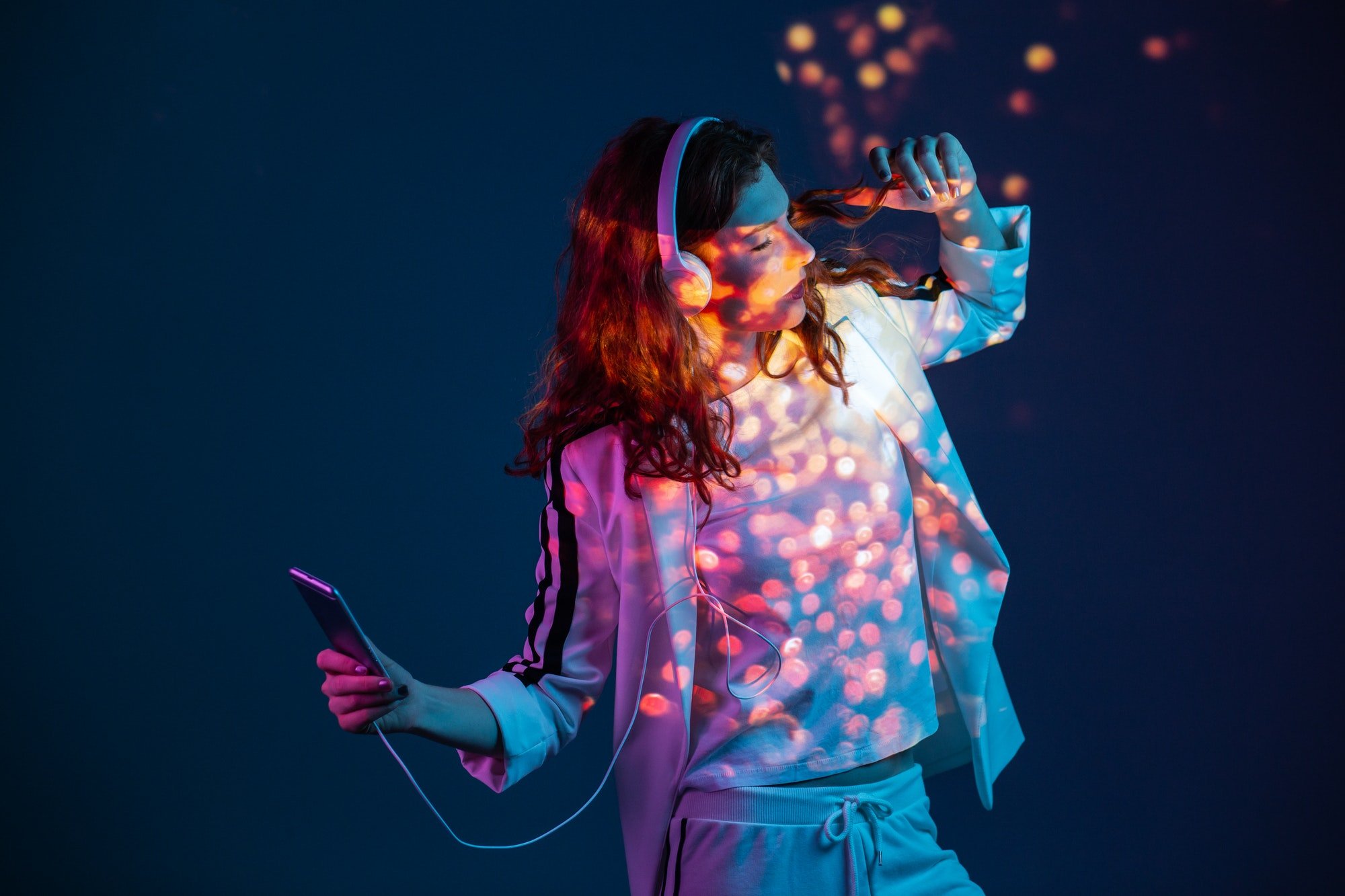 Woman enjoying music with smartphone