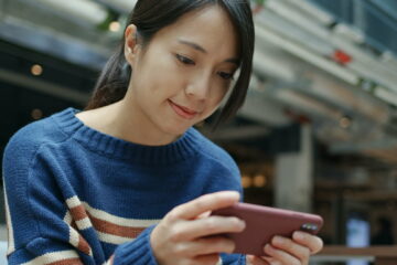 Woman play game on cellphone