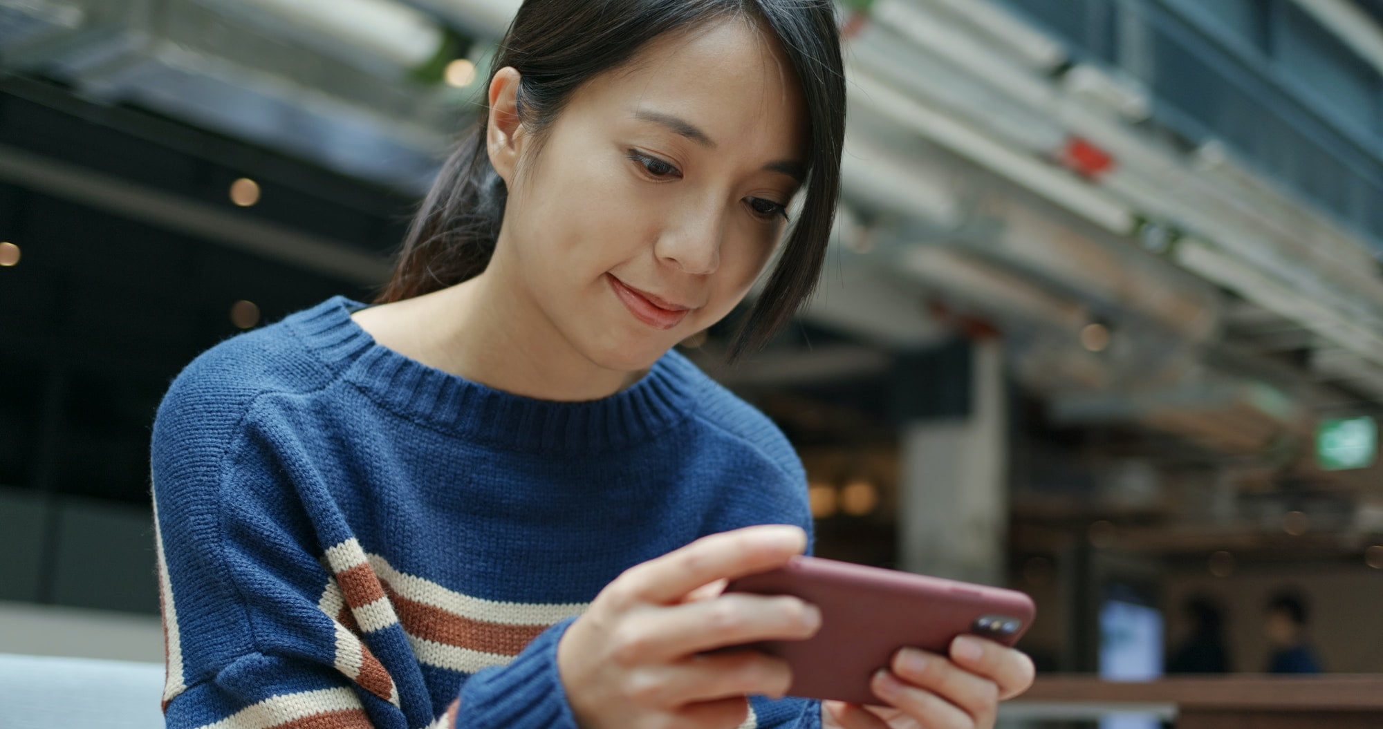 Woman play game on cellphone