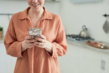 Woman typing a message on the phone