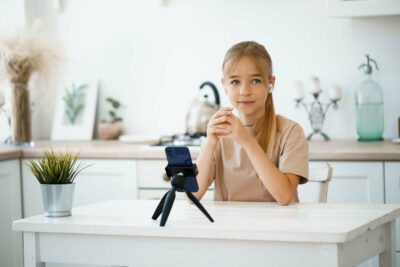 Little caucasian girl having a video call on mobile phone