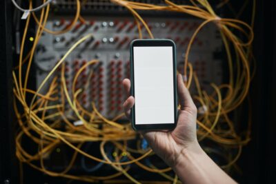 Network Engineer Using Smartphone