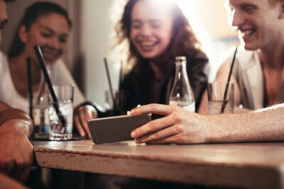 Group of friends watching video on the mobile phone