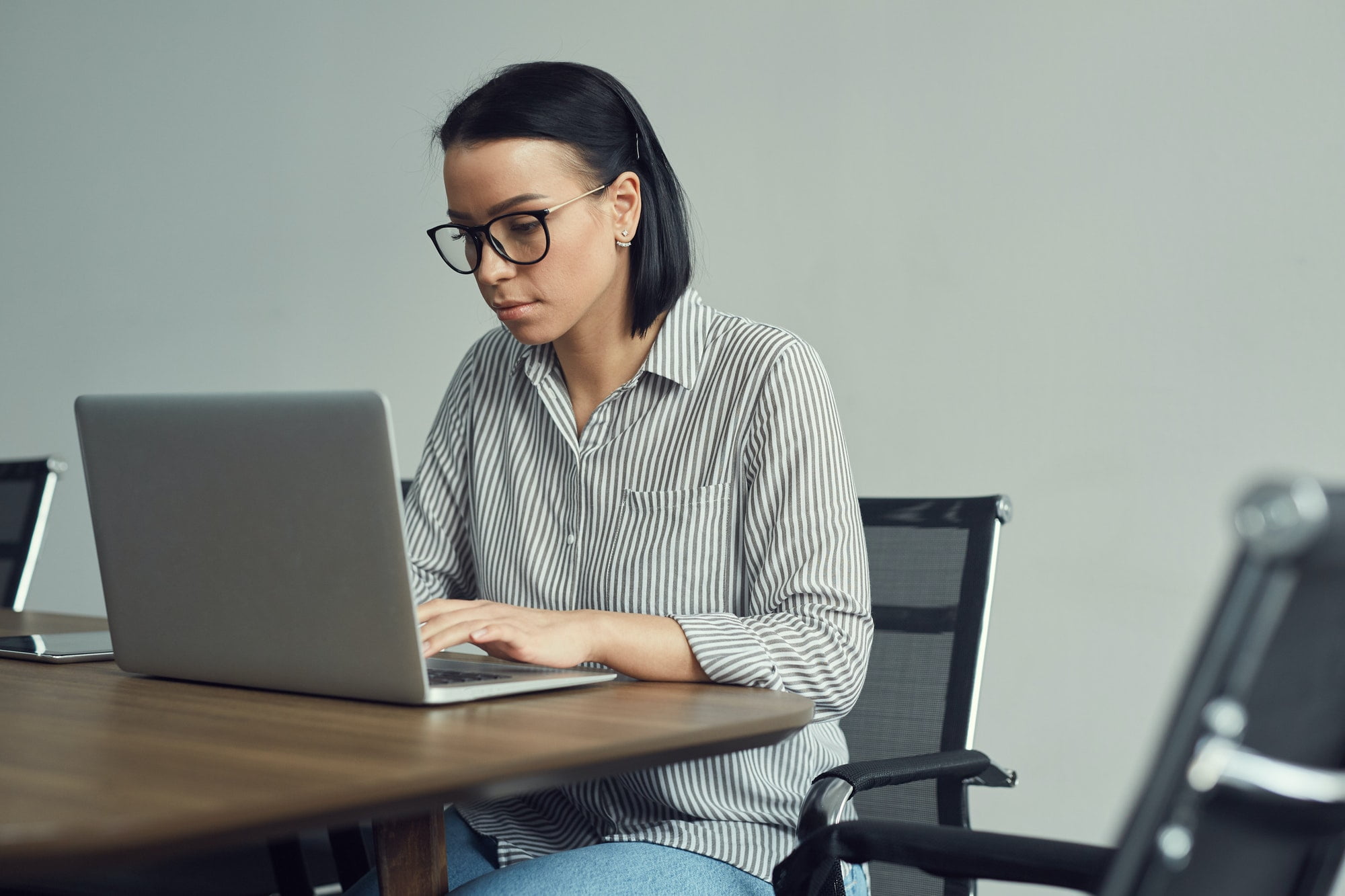 Businesswoman typing on laptop