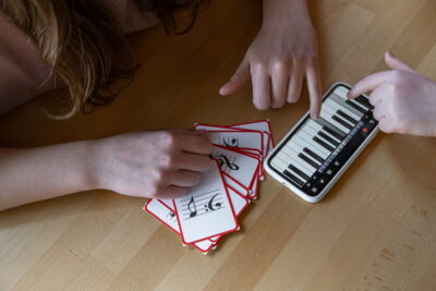 Close-up of cards for studying music and piano in the phone.