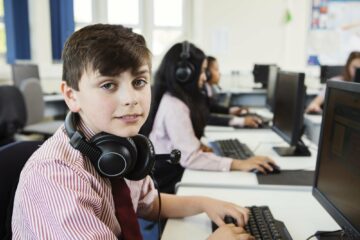 Students using computer in classroom