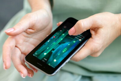 Woman checking daily instagram reels, social media is part of our lives. Female hands only in frame.