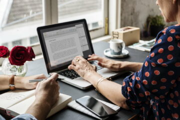 Woman Working on Laptop Typing Essay Information