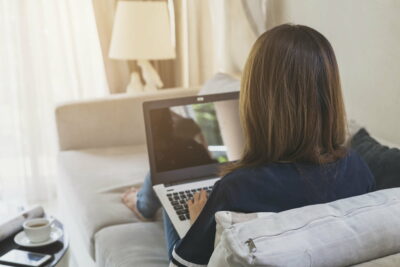 woman using a laptop searching web, browsing information