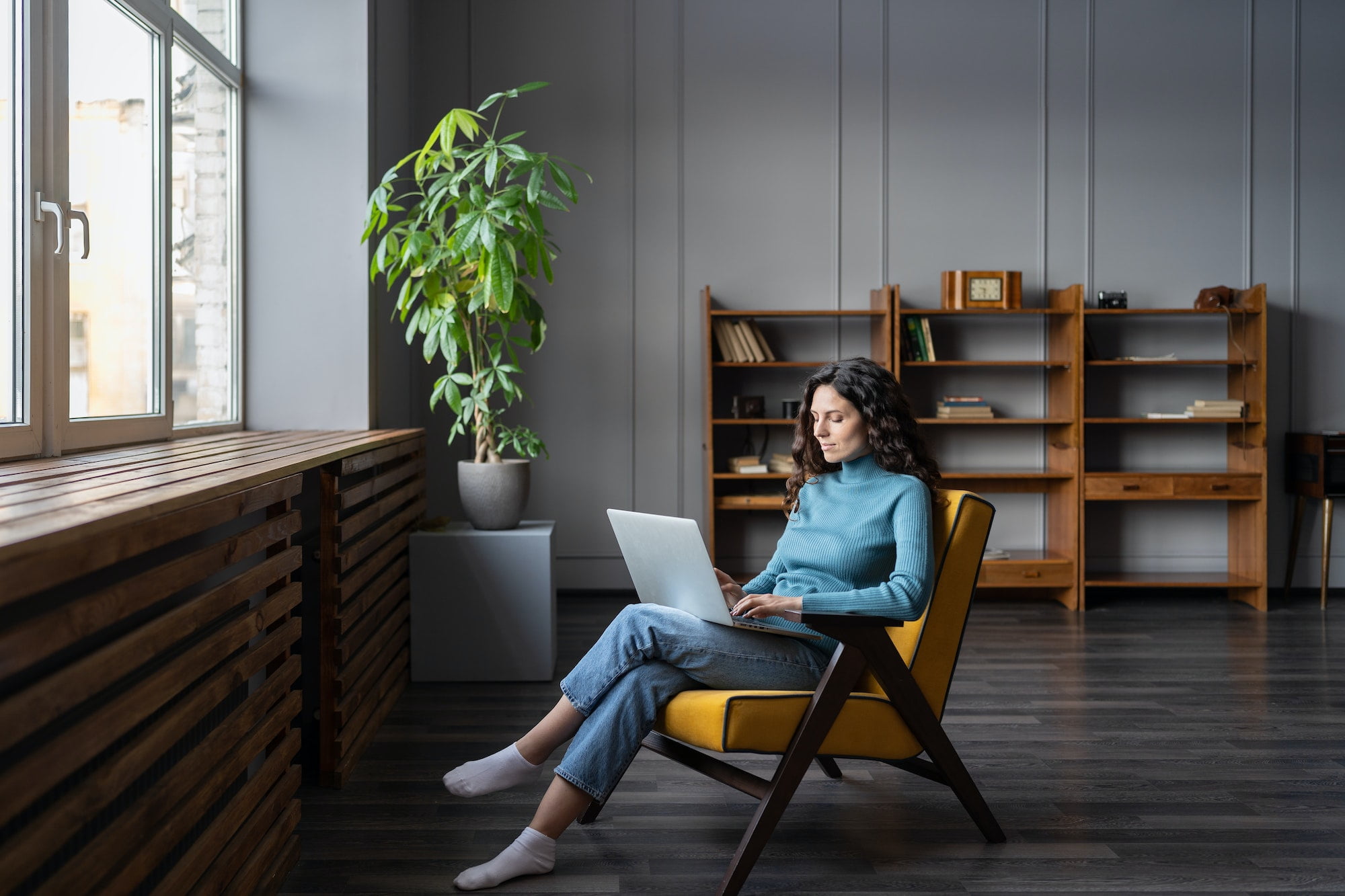 Young woman freelancer work on laptop at home typing email to client or shopping in internet store