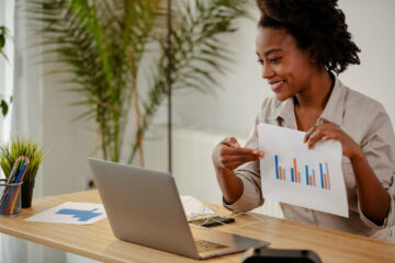 Businesswoman is presenting the results of the survey to their colleagues in an online meeting.