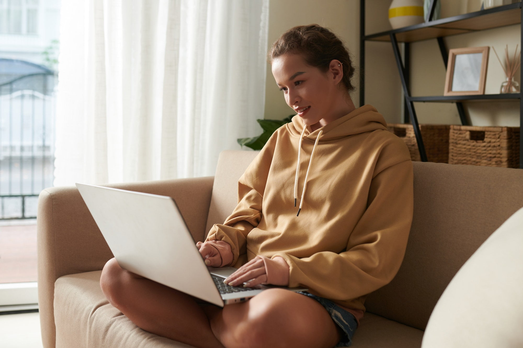 Young woman using laptop at home