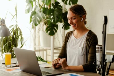 Businesswoman working from home making a video call. Female having a zoom call with colleagues.