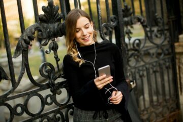 Young woman listening music outdoor