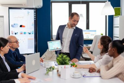 Employee asking executive questions during presentation