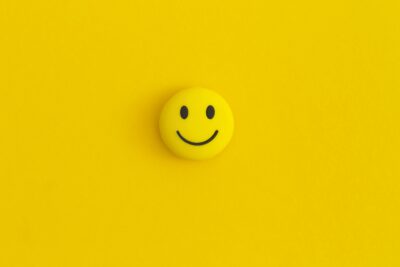 Emoticon smile on a yellow background