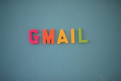 Gmail spelled out with spelling blocks against solid background